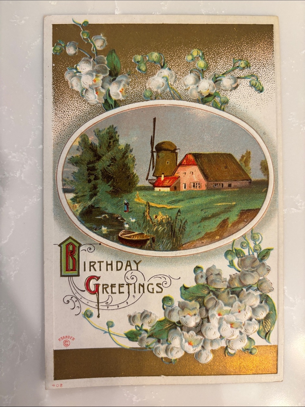 Vintage Bday Greetings Windmill River Canoe LillyoftheValley Gold Gilt Postcard